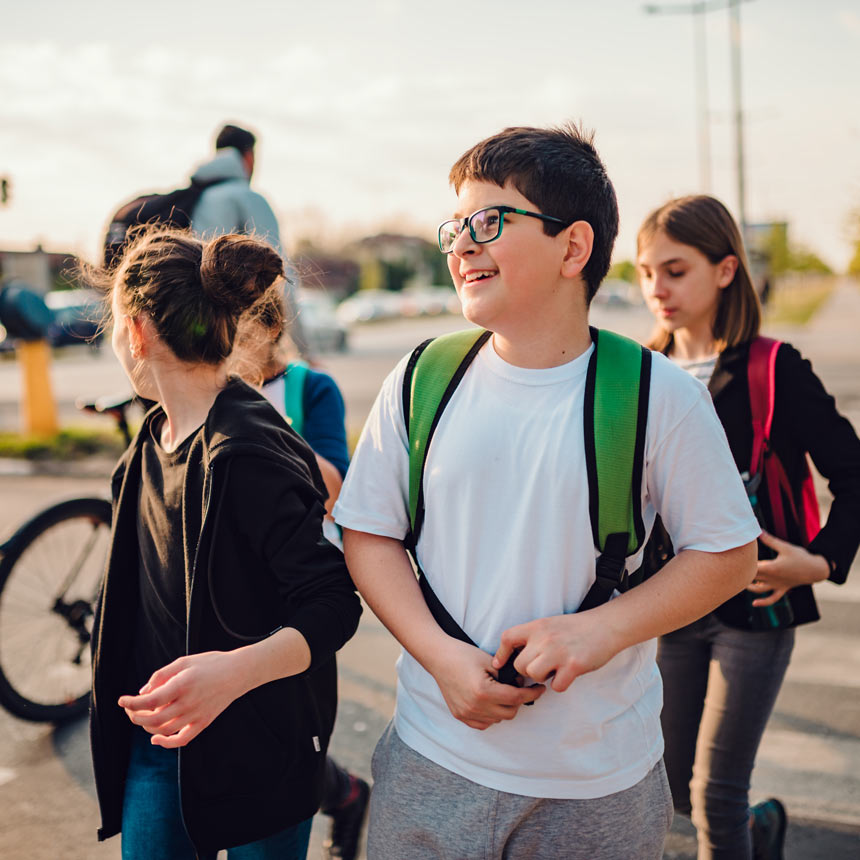 Group of kids crossing the street on the way to school.