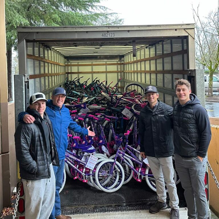 Members of the Ferguson-Murphy Charities Inc. team unload bikes to deliver to kids for the holidays